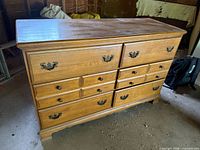 Front view of dresser showing all eight drawers closed