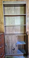 Full view of bookcase showing shelves and lower cabinet