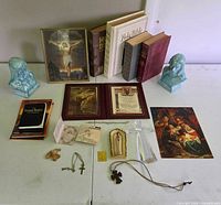 Full layout showing all books, figurines, crosses, prints and small devotional items