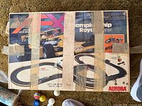 Box lid showing Aurora AFX Championship Royale graphics and taped condition