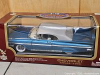 Front angled view of boxed 1:18 scale 1959 Chevrolet Impala model