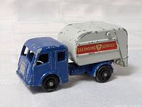 Left front view showing blue cab and grey refuse body with Cleansing Service decal