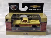 Front view of sealed M2 1973 Chevy truck in packaging