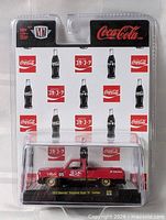 Front view of packaged M2 Machines Coca-Cola 1973 Chevrolet Cheyenne die-cast truck