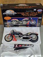 Motorcycle model in Styrofoam base with box lid showing graphics