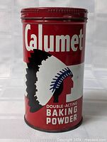 Front view showing Calumet logo, Native American profile graphic and lid