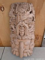 Full view of carved wood relief front