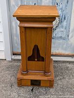 Full view of oak podium plant stand with base plaque