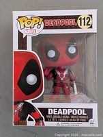 Front view of sealed Funko Pop Deadpool #112 box