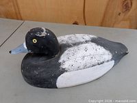Left front quarter view of carved duck decoy
