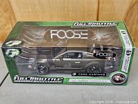 Front-left view of boxed Full Throttle Foose Ford Mustang model