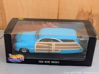 Front angled view of boxed Hot Wheels 1950 Merc Woodie model