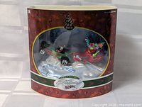 Front view of sealed Hot Wheels Holiday 2001 set in curved window box