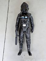 Full-length view of TIE Fighter Pilot figure lying flat