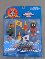Front view of sealed Looney Tunes action figure set in blister package