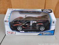 Front angled view of boxed Maisto Ferrari FXX K model