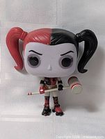 Front view of Harley Quinn Funko Pop vinyl figure on roller skates with mallet