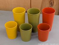 Front view of all six Tupperware tumblers showing colours and two height variants