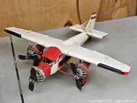 Front left view showing overall airplane model, three radial engines, landing gear