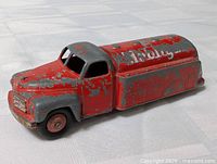 Left side view of red Dinky Mobilgas tanker, shows overall paint wear