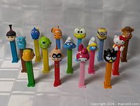 All fifteen PEZ dispensers in two rows