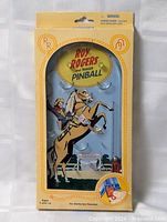 Front view of sealed Roy Rogers handheld pinball game package