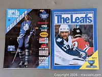 Calendar and magazine front covers side by side