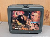 Front view of dark gray Thermos plastic lunchbox showing Star Wars Attack of the Clones artwork