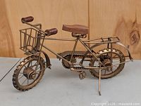Right side view of metal and wood bicycle sculpture