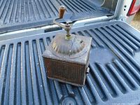Overall top view of grinder showing crank and dome lid