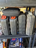 Five black plastic and fabric cases on shelving, showing quantity of cases included