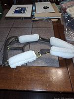 Full view of halter laid flat showing padding and brass hardware