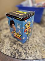 Cardboard outer box side featuring Toy Story 2 artwork