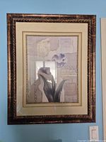 Full view of framed collage print on wall