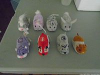 Group view of all eight plush pets on table