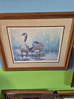 Full view of framed print showing geese, frame and mats