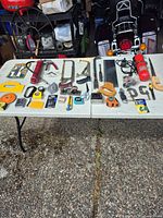 Overall view of both tables showing full assortment of hand tools
