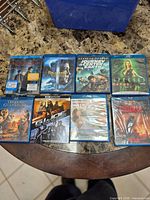 First set of seven Blu-ray cases on marbled table