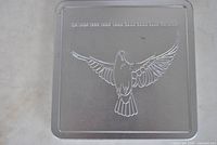 Square metal tin with embossed dove and CANADA text