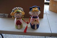 Front view of one boy-and-girl piggy bank pair