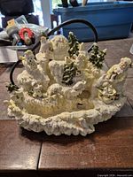 Front view of resin snowy village fountain showing igloo, Santa on sled, polar bears and wiring