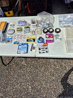 Full layout view of assorted hardware and tapes on table