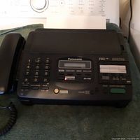 Front view of Panasonic KX-F780C with handset attached