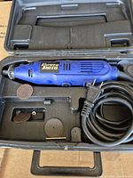 PowerSmith corded rotary tool in molded carry case with discs and cord visible