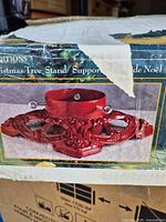 Box image showing red cast iron stand design
