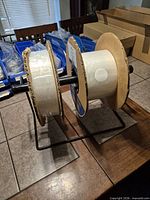 Front view of dispenser stand with two rolls mounted