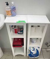 Front view of both matching white side tables showing shelves and general condition