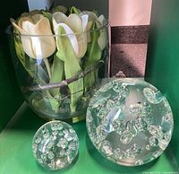 Vase with faux tulips and two bubble glass paperweights