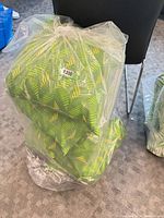 Bagged stack of new green geometric seat cushions