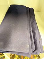 Stack of folded solid grey cushion covers